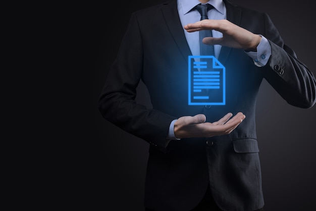 Businessman man holding a document icon in his hand Document Management Data System Business Internet Technology Concept. Corporate data management system DMS .