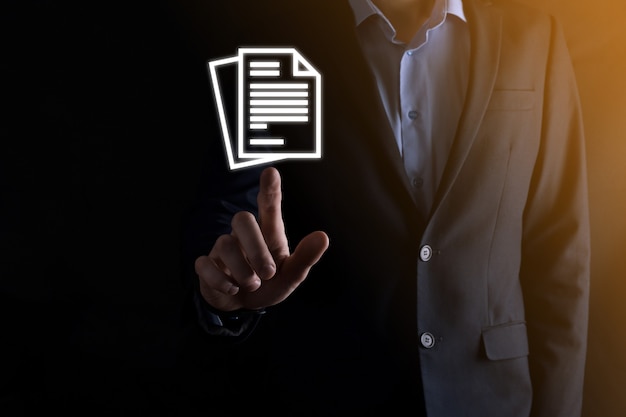 Businessman man holding a document icon in his hand Document Management Data System Business Internet Technology Concept. Corporate data management system DMS .