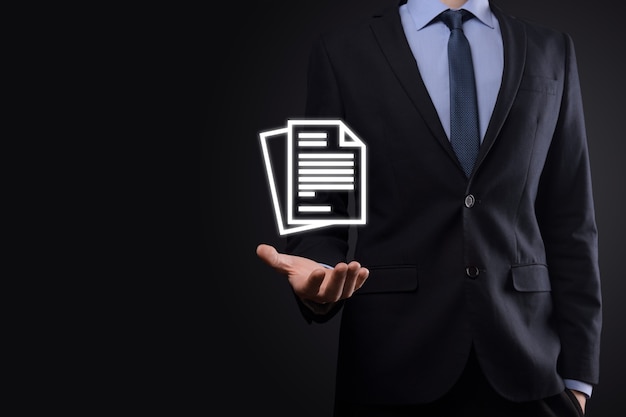 Businessman man holding a document icon in his hand