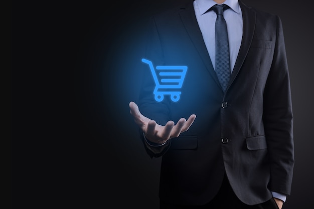 Businessman man holding shopping cart trolley mini cart in business digital payment