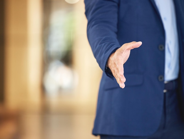 Photo businessman meeting and interview with handshake for greeting agreement or deal at office closeup of man or employee shaking hands for team hiring recruiting or partnership in b2b at workplace