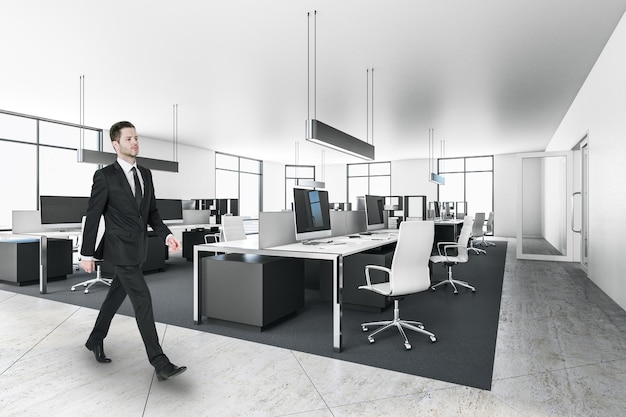 Businessman in modern office interior with furniture