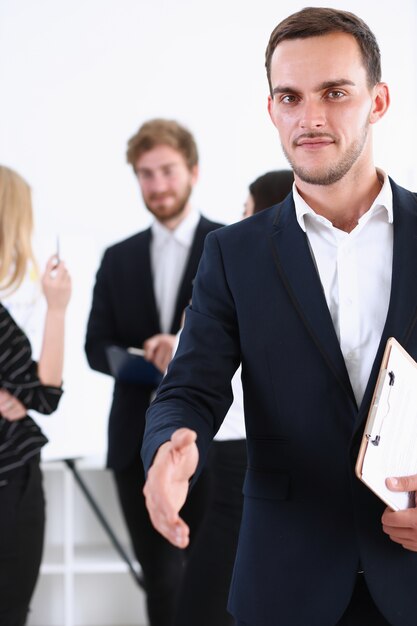 Photo businessman offer hand to shake as hello closeup