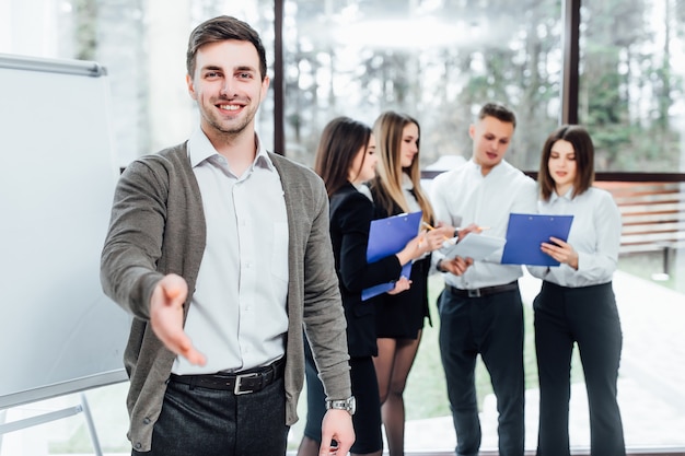 Businessman offer hand to shake as hello in office. Serious business, friendly support service, excellent prospect, introduction or thanks gesture, gratitude