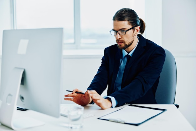 Businessman in the office gestures with his hands executive