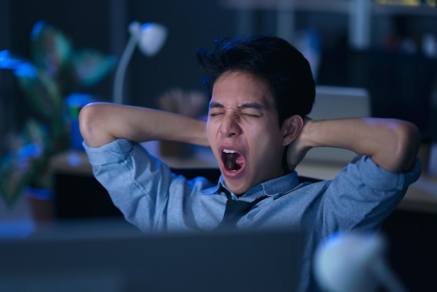 Businessman in the office at night