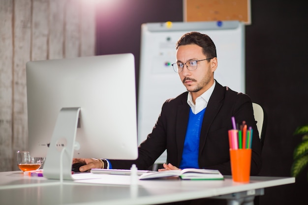 Businessman at office work with computer monitor