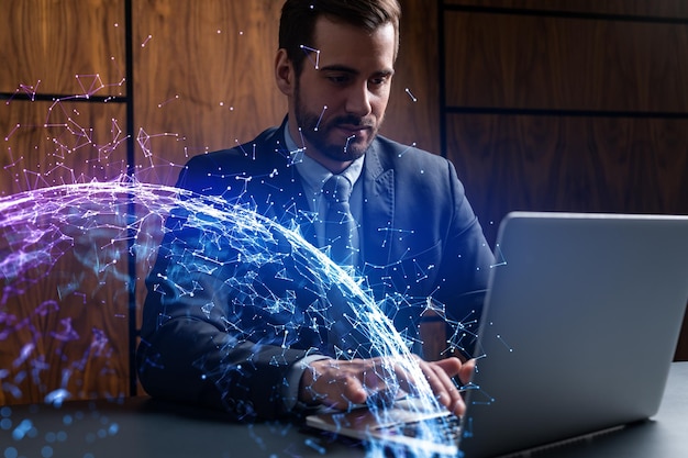 Businessman in office working with laptop abstract technology hologram typing computer Double exposure