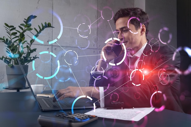 Businessman in office working with laptop abstract technology hologram typing computer Double exposure