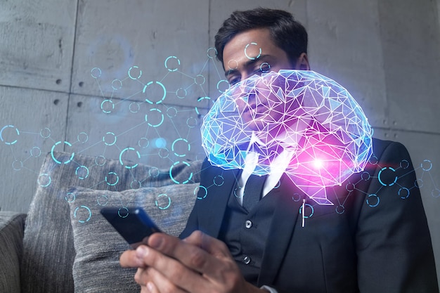 Businessman in office working with Smartphone Brain hologram to optimize the process typing phone Double exposure