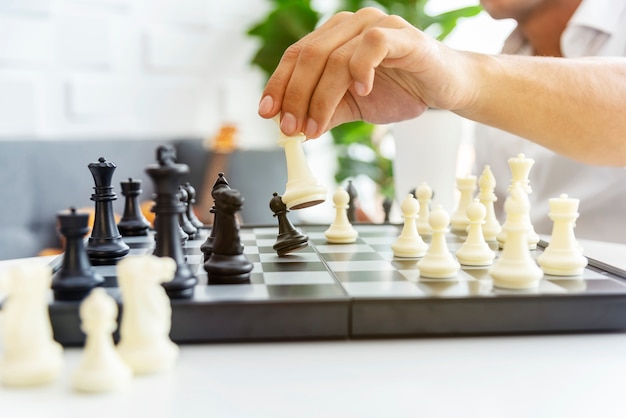 Businessman playing the chess game. Business strategy and tactic planing.