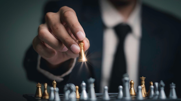 Businessman playing chess think problem solving business competition planning teamworkInternational chess ideas and competition and strategy business success conceptstrategic concept