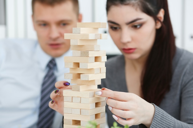 Businessman playing jenga