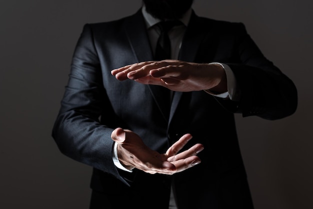 Businessman Pointing Important Message Between Hands Man In Suit Presenting Crutial Informations Among Palms Executive Showing Recent Announcements New Ideas Displayed