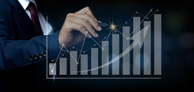 Businessman pointing spot on the graph finance chart. Digital business hologram graph finance chart background. For the business and finance concept.