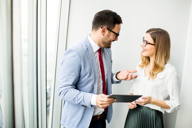 Businessman presenting business data on digital tablet at office