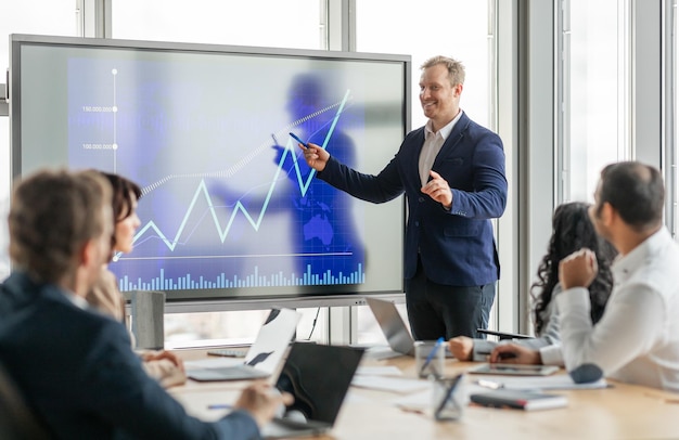 Photo businessman presenting financial data during meeting in modern office