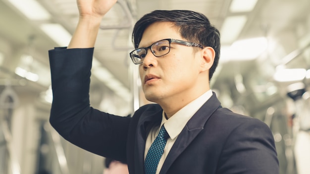 Businessman in a public train