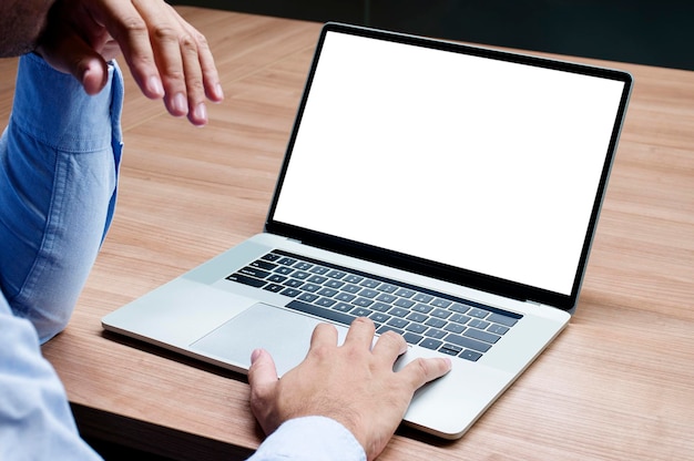 Businessman raise your hand with white screen background mock up on display laptop