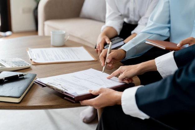 Businessman reading documents at meeting business partner considering contract terms before signing checking legal contract law conditions