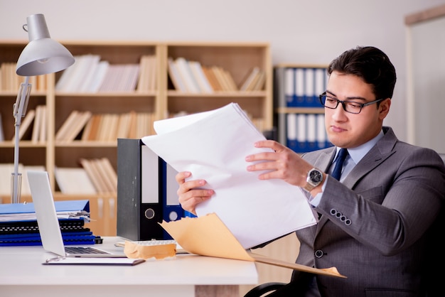 Businessman receiving letter envelope in office