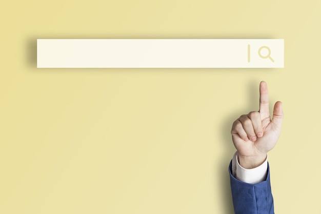 Businessman's finger pointing at internet search page on virtual touch screen yellow background