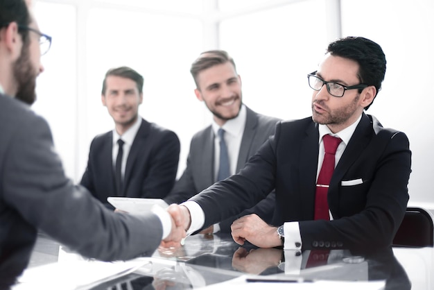 Businessman shaking hands with his business partnerconcept of partnership