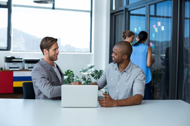 Businessman shaking hands with male executive