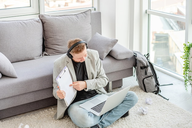 Businessman showing papers during online conference