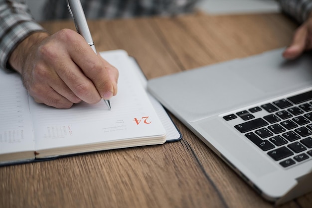 Businessman signing a document after reading the agreement in office