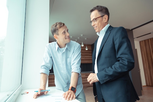 Businessman signing papers while buying the house