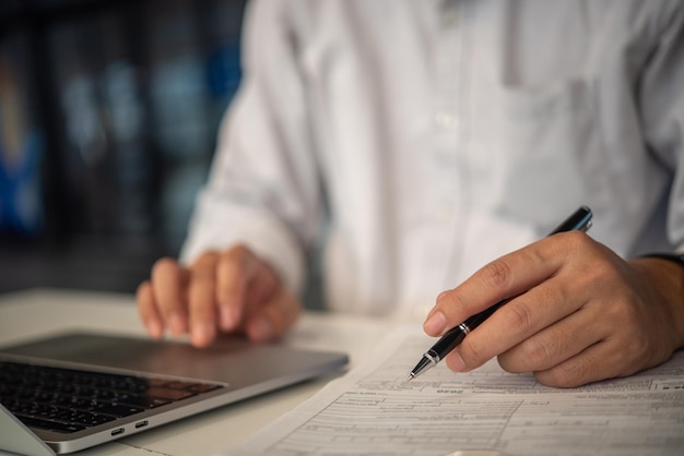 Businessman signs contract investment professional documents with a pen making the signature Financial and insurance job application