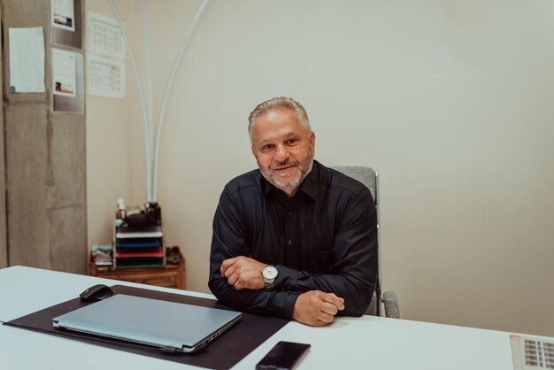 A businessman sits in his and works with paperwork High quality photo