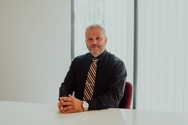 A businessman sits in his and works with paperwork.High quality photo