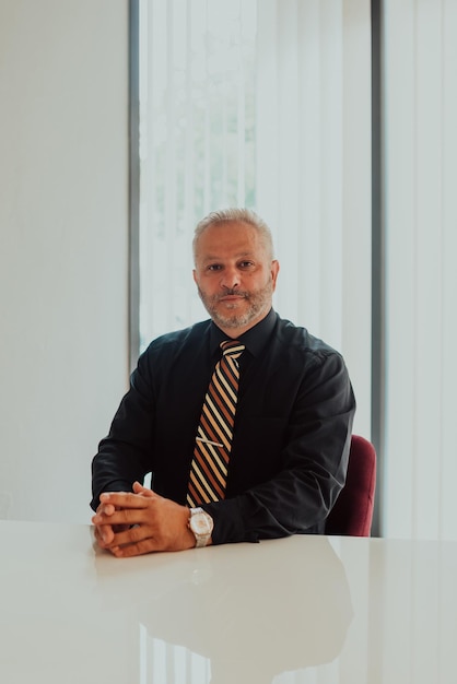 A businessman sits in his and works with paperwork.High quality photo