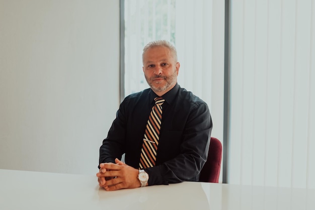 A businessman sits in his and works with paperworkHigh quality photo