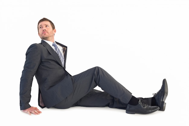 Businessman sitting and looking up