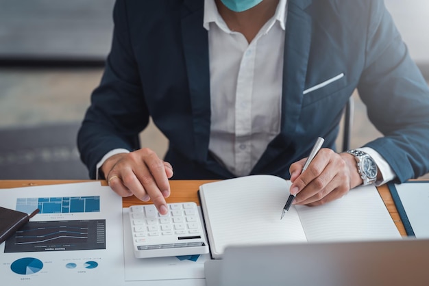 Businessman sitting planning analyze investment and marketing on the desk in the office