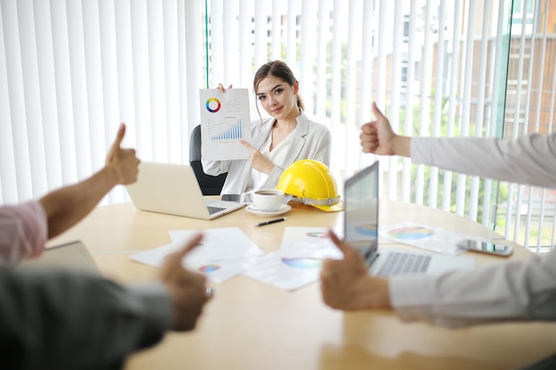 businessman and smart woman people group present explaining colleagues latest profit financial data