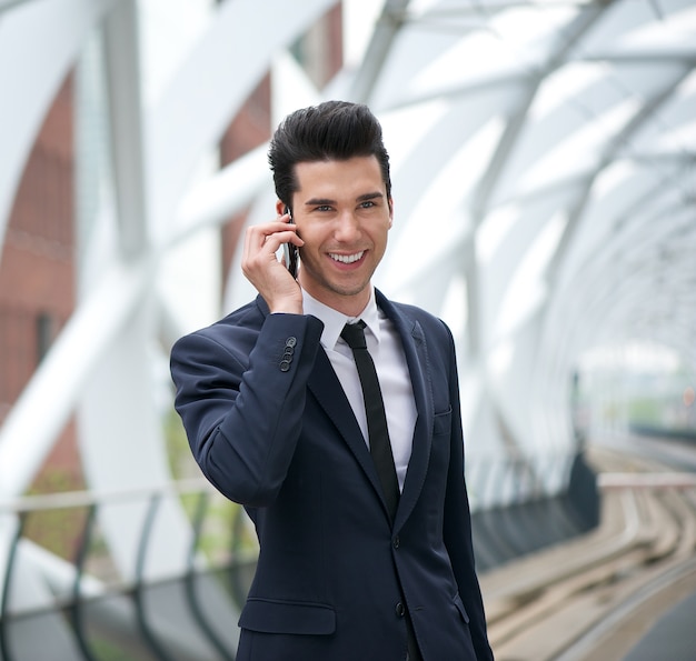 Businessman smiling and talking on the phone