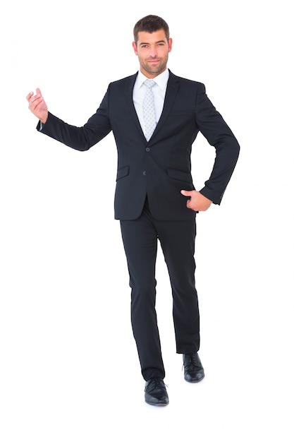 Businessman smiling with hands up on white background