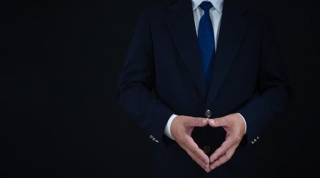 businessman standing on dark background business concept suit