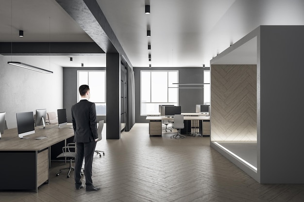 Businessman standing in modern office interior