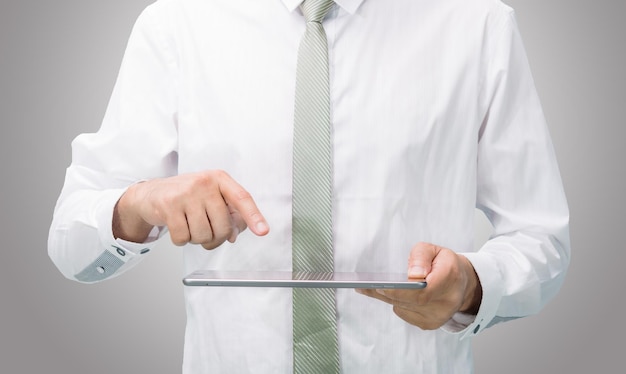 Businessman standing posture hand holding blank tablet isolated