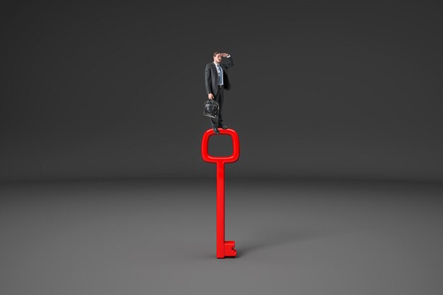 Photo businessman standing on red key and looking into the distance on gray background access and vision concept