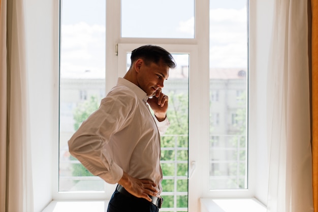 Businessman stretching in his home