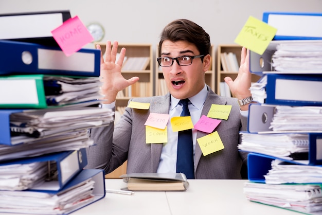 Businessman struggling with multiple priorities