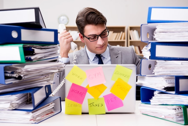 Businessman struggling with multiple priorities