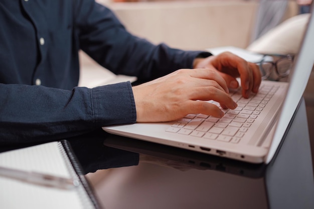 Businessman or student using laptop at home