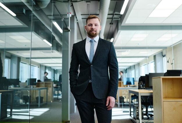 Businessman in suit standing at office